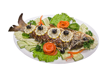 Fish with vegetable on plate isolated. Food with lemon, salad, olives, carrot
