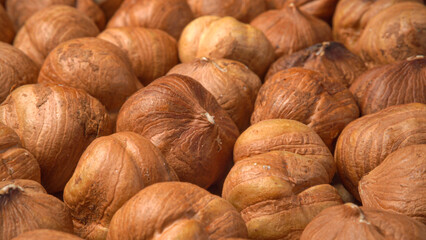 Peeled hazelnuts closeup texture. Hazelnuts horizontal pan