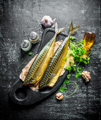 Fragrant smoked mackerel with herbs and garlic cloves.