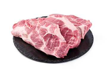 Raw pork shoulder steaks, isolated on white background. High resolution image.