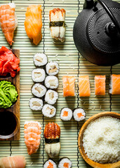 Various sushi and rolls on a napkin.