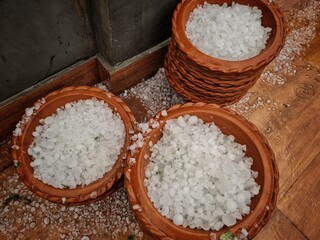 hailstorm collected in a planter