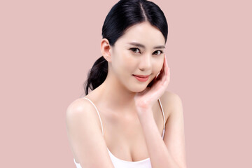 Studio shot of Beautiful young Asian woman with clean fresh skin on pink background, Face care,...