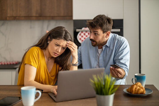 Unhappy, Stressed And Upset Couple Paying Bills With A Laptop