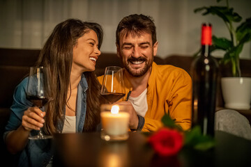 Couple toasting with red wine