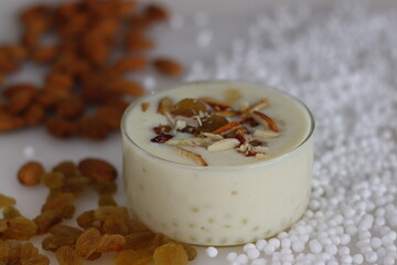 Sabudana kheer. A creamy thick Indian pudding made with tapioca pearls, condensed milk, sweetener and flavored with cardamoms. Served with raisins and chopped almonds on top