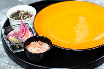 Empty plate with spices and fragrant herbs, selective focus, food photo mockup, copy space
