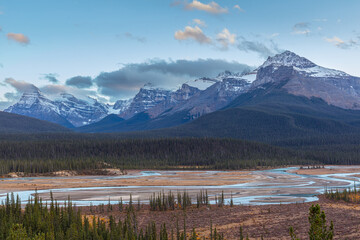 Landscape with mountains and braided river in the blue hour just after sunset, Saskatchewan River Crossing Canada
