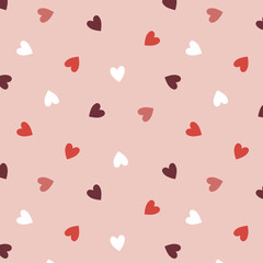 Beige seamless background. Valentine's day with colorful hearts. Endless ornament with beautiful hearts for Valentine's Day.