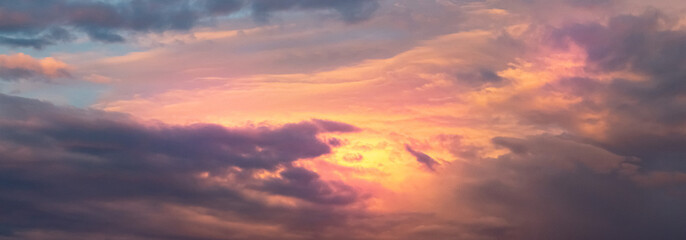 Sky panorama at sunset, bright beautiful colors of the evening sky