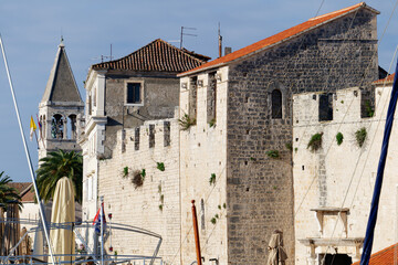 View of the city of Trogir in Croatia. River flowing below the bridge and mountains in the...