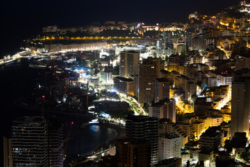 Monte Carlo panorama illuminated by night. Urban landscape with luxury architecture.