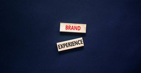 Brand experience symbol. Concept words Brand experience on wooden blocks. Beautiful black table...