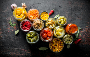 Various preserved vegetables in jars.