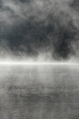 Misty nature background of mountain lake