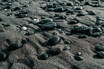 Fototapeta na wymiar sea shore with round wet stones