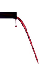 Red wine pouring from bottle isolated on transparent background.