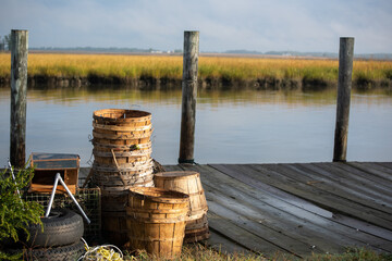 Crabbing gear on pier with beautiful tidal mash in background.
