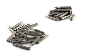 Isolated on a white background tips of a group of phillips head screwdriver bits. Top view.