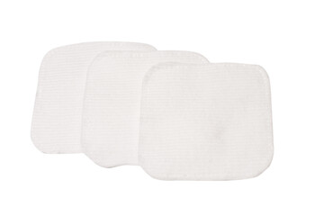 Stack of white cotton sponges isolated on a white background.