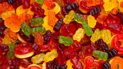 Assorted colorful gummy candies. Jelly donuts. Jelly bears.
