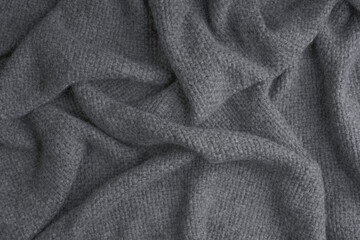 Close up of bunched up waffle weave gray throw blanket