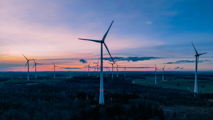 silhouette of wind farm over the beautiful evening sky at sunset
