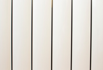 Background of white metal planks, painted in eco-friendly colors, vertical arrangement.