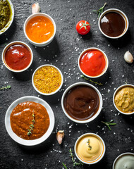 Different kinds of sauces in bowls.