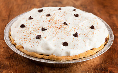 Chocolate Cream Pie Topped with Chocolate Chips and Cocoa on Cream