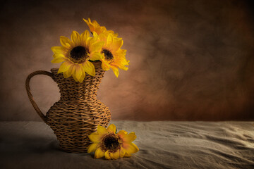 Sunflowers in a wicker pitcher