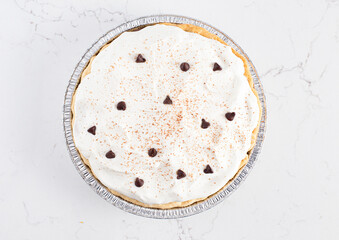 Chocolate Cream Pie Topped with Chocolate Chips and Cocoa on Cream