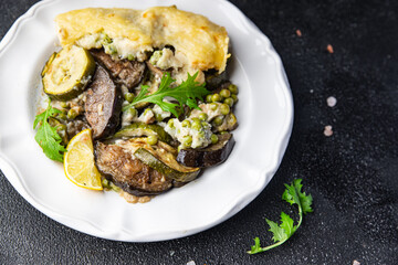 vegetables casserole eggplant, zucchini, green peas, cheese, bechamel sauce vegetable lasagne healthy meal food snack on the table copy space food background rustic top view keto or paleo diet veggie