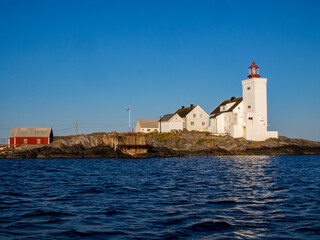 Lighthouse in south of Norway, Homborsund at the summer with blue sky and a clear view