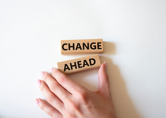 Change ahead symbol. Wooden blocks with words Change ahead. Businessman hand. Beautiful white...