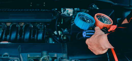 car service worker repairing vehicle , For customers who use cars for repair services .