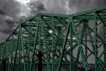 Fototapeta premium Bridge below Stormy Sky