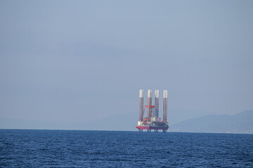 Oil refinery platform at the open sea, producing black gold, Aegean Sea, Greece 