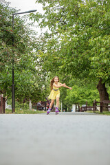 Fototapeta na wymiar Child rollerblading fast at skate park. Having fun. Concept of an active lifestyle and childhood