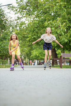 Two children are rollerblading at skate park. Concept of an active lifestyle, hobbies and childhood