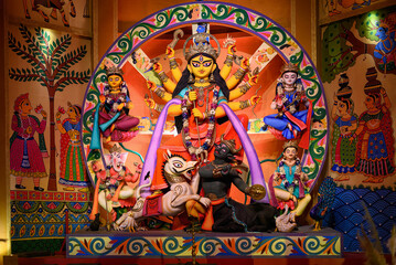 Idol of Goddess Devi Durga at a decorated puja pandal in Kolkata, West Bengal, India. Durga Puja is...