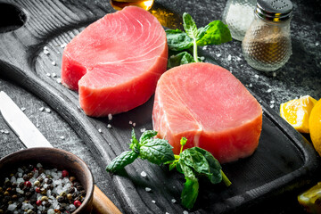 Raw tuna steak with herbs and spices.