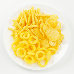 A plate of corn chips snacks with cheese on a white background.