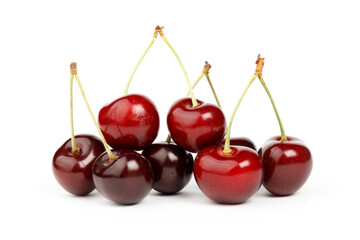 Fresh red cherries on a white background, summer fruit.