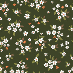 Fototapeta na wymiar Vector floral seamless pattern. Abstract luxurious pattern with small orange and white flowers on a green background, leaves, branches. Liberty style wallpaper.