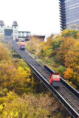 Fototapeta premium old Incliner on rail tracks climbing up hill in Pittsburg in the fall