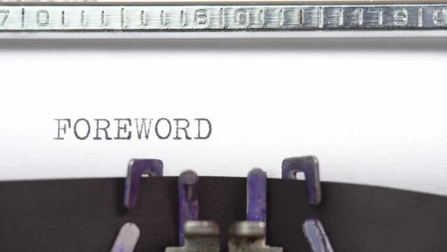 Foreword word close up being typing and centered on a sheet of paper on old vintage typewriter mechanical
