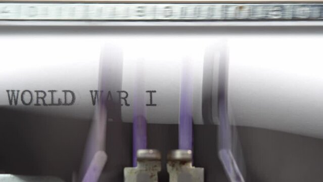 World War 2 word closeup being typing and centered on a sheet of paper on old vintage typewriter mechanical