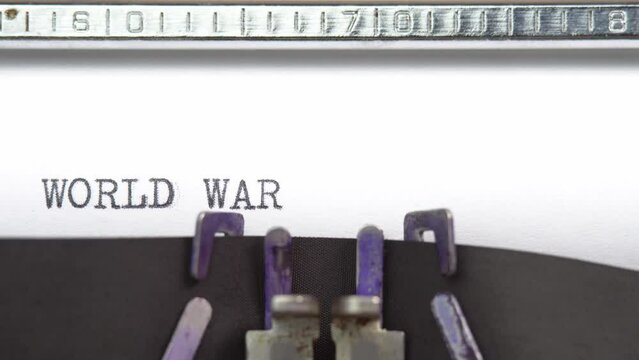 World War 1 word closeup being typing and centered on a sheet of paper on old vintage typewriter mechanical