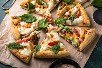 Italian pizza with feta cheese, tomato and basil